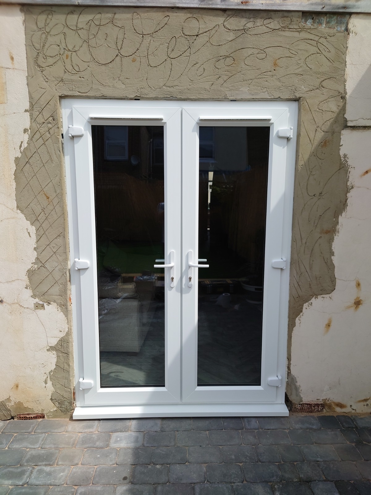 uPVC French doors fitted by HDS, opening onto a garden